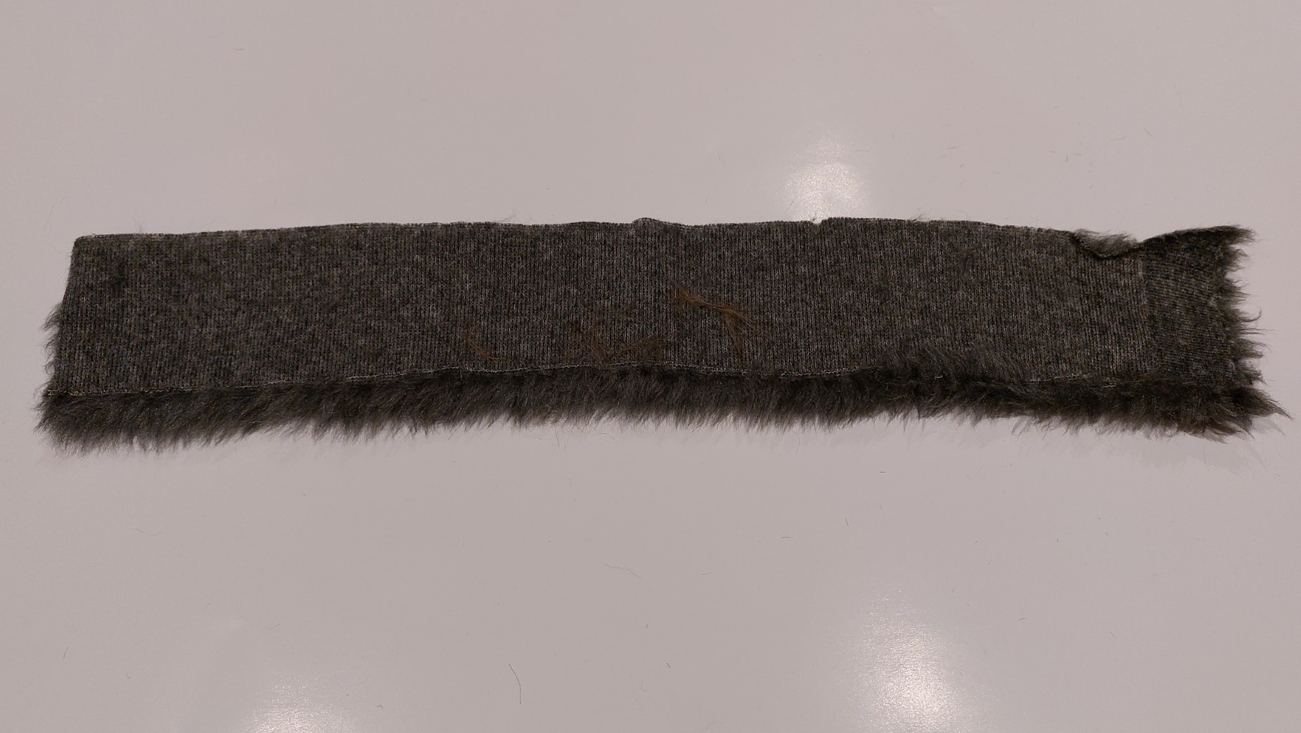Reverse side of the boot topper with hand sewing