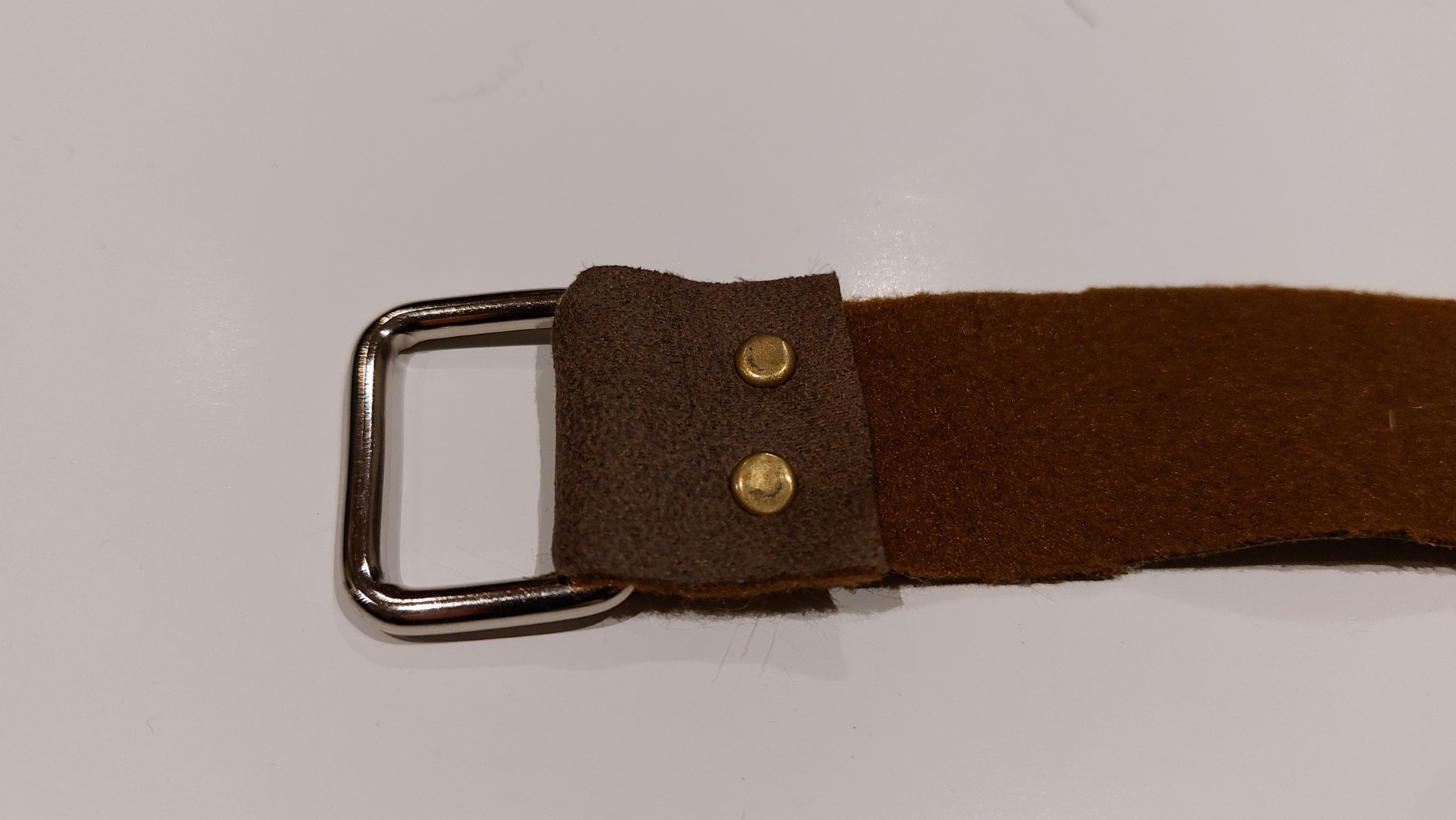 Faux leather eyelet and rivets
