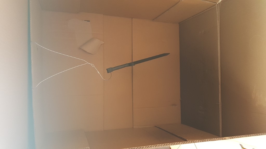 Dagger hanging in the spray "booth"
